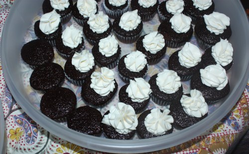 "cupcakes being frosted"