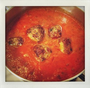 "simmering cubic meatballs"
