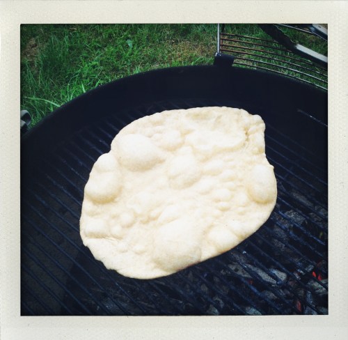 "pizza dough grilling looks like moon bread"