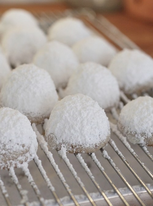 It's snowing powdered sugar on top of Mexican Wedding Cookies