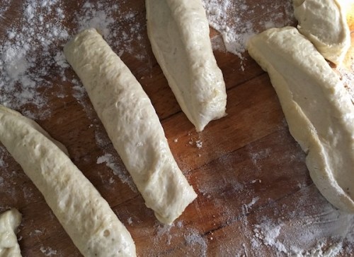 Pita bread cut into 2 ounce pieces ready to roll