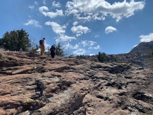 Russell and Isabelle scrambling up Elk Mountain in the Wichita Mountains National Wildlife Refuge