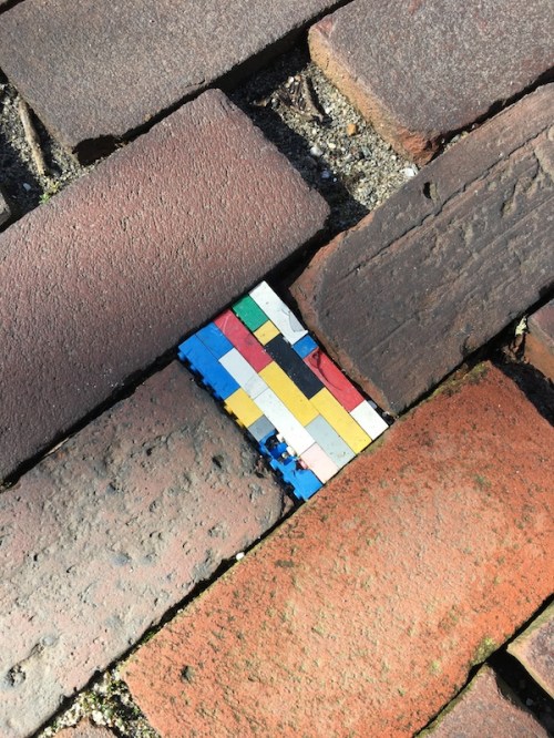 Brick sidewalk on Nantucket with Lego Brick insert.